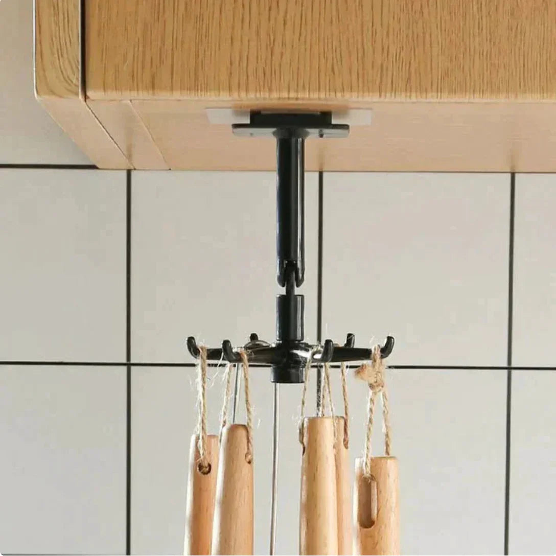 Support de rangement SkyGrip fixé sous meuble, suspendant des ustensiles de cuisine en bois.