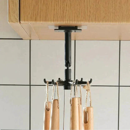 Support de rangement SkyGrip fixé sous meuble, suspendant des ustensiles de cuisine en bois.